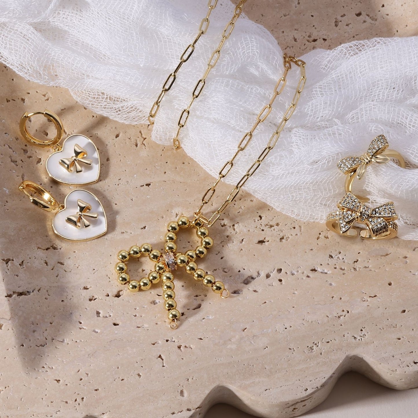 Huggies with Bow Accented White Heart