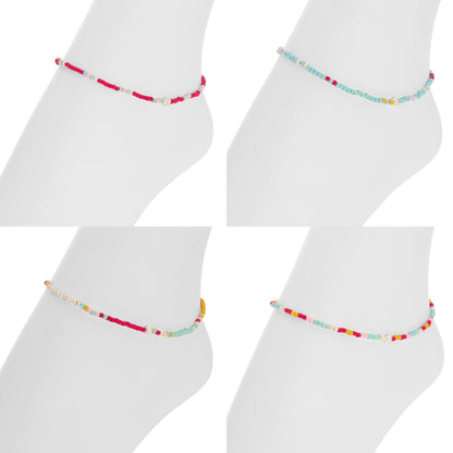 Colorful beaded anklets on white socks against a white background
