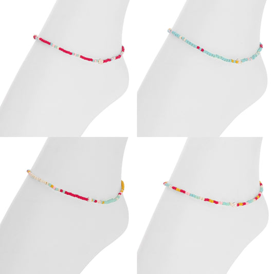 Colorful beaded anklets on white socks against a white background