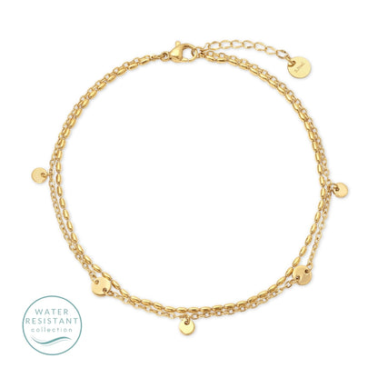 Gold bracelet with small round pendants on a white background