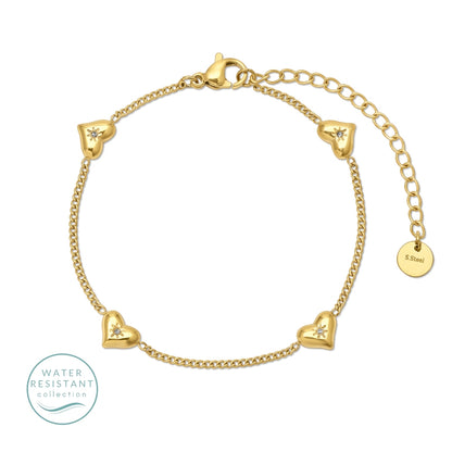water resistant Gold bracelet with cubic zirconia and heart-shaped charms on a white background
