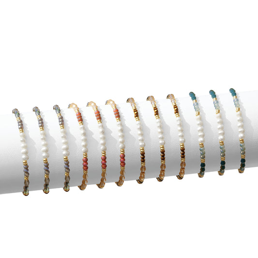 Set/12 crystal and disc stretch bracelets w/5 pearls