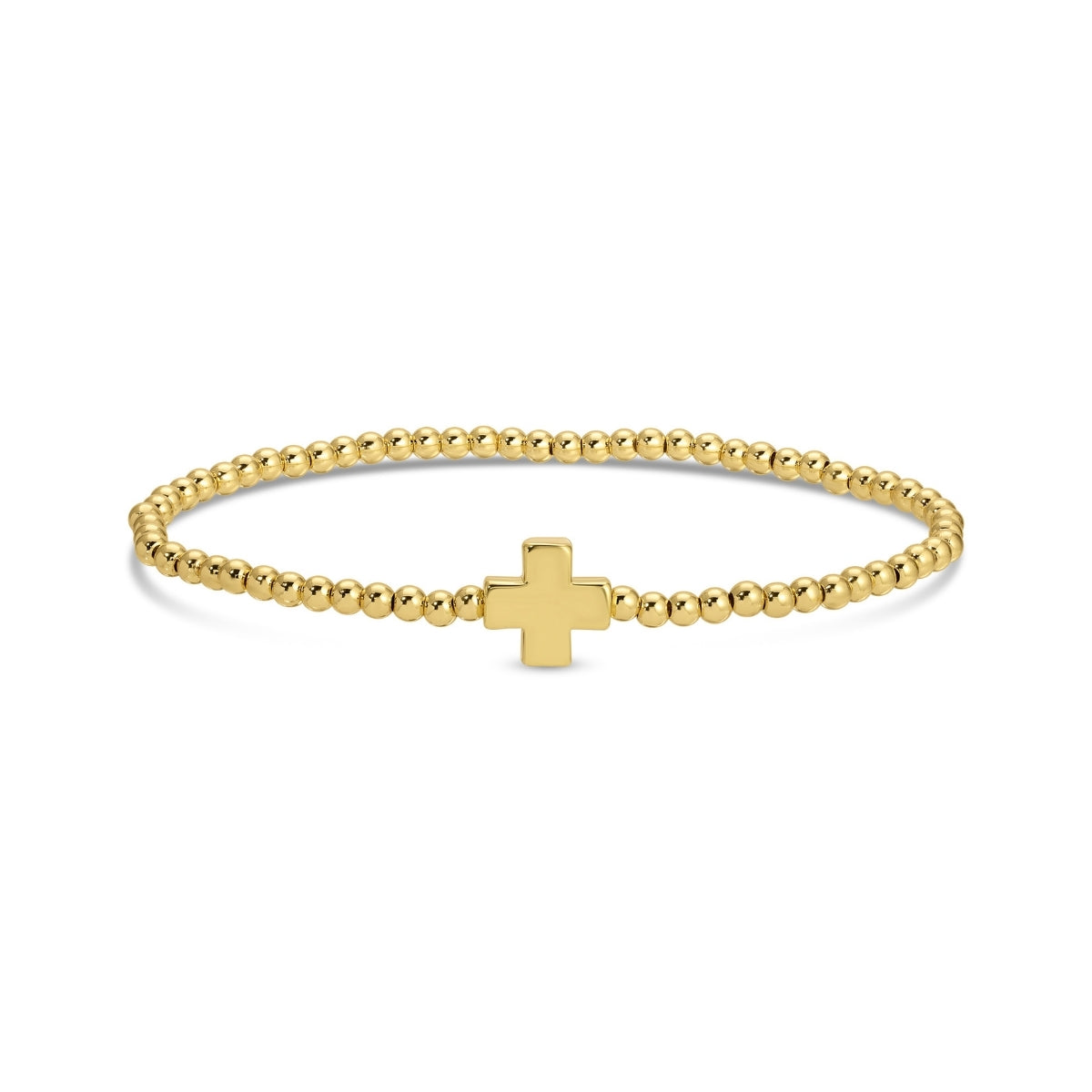 Gold bracelet with a small cross charm on a white background