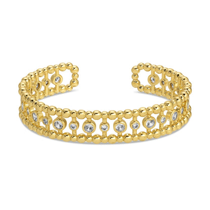 Gold bracelet with diamond accents on a white background