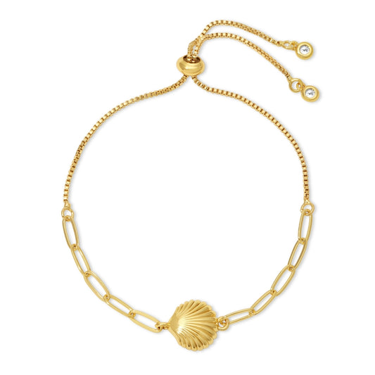 Gold bracelet with a shell charm on a white background