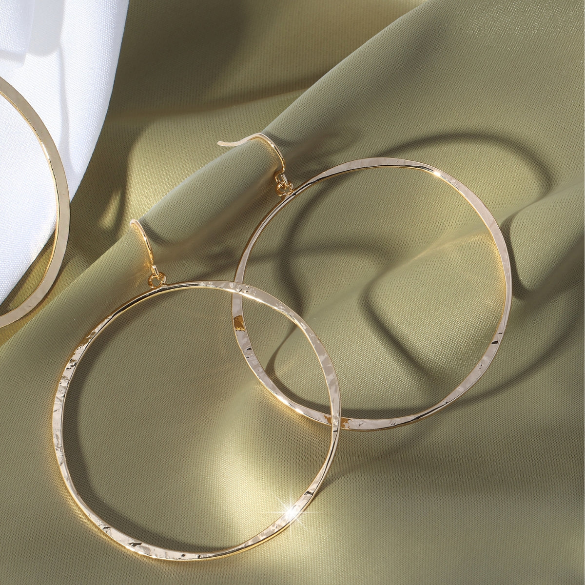 Large lightly hammered open circle earrings