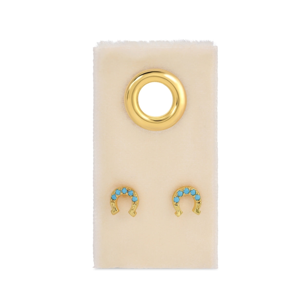 Gold and turquoise earrings on a beige card 