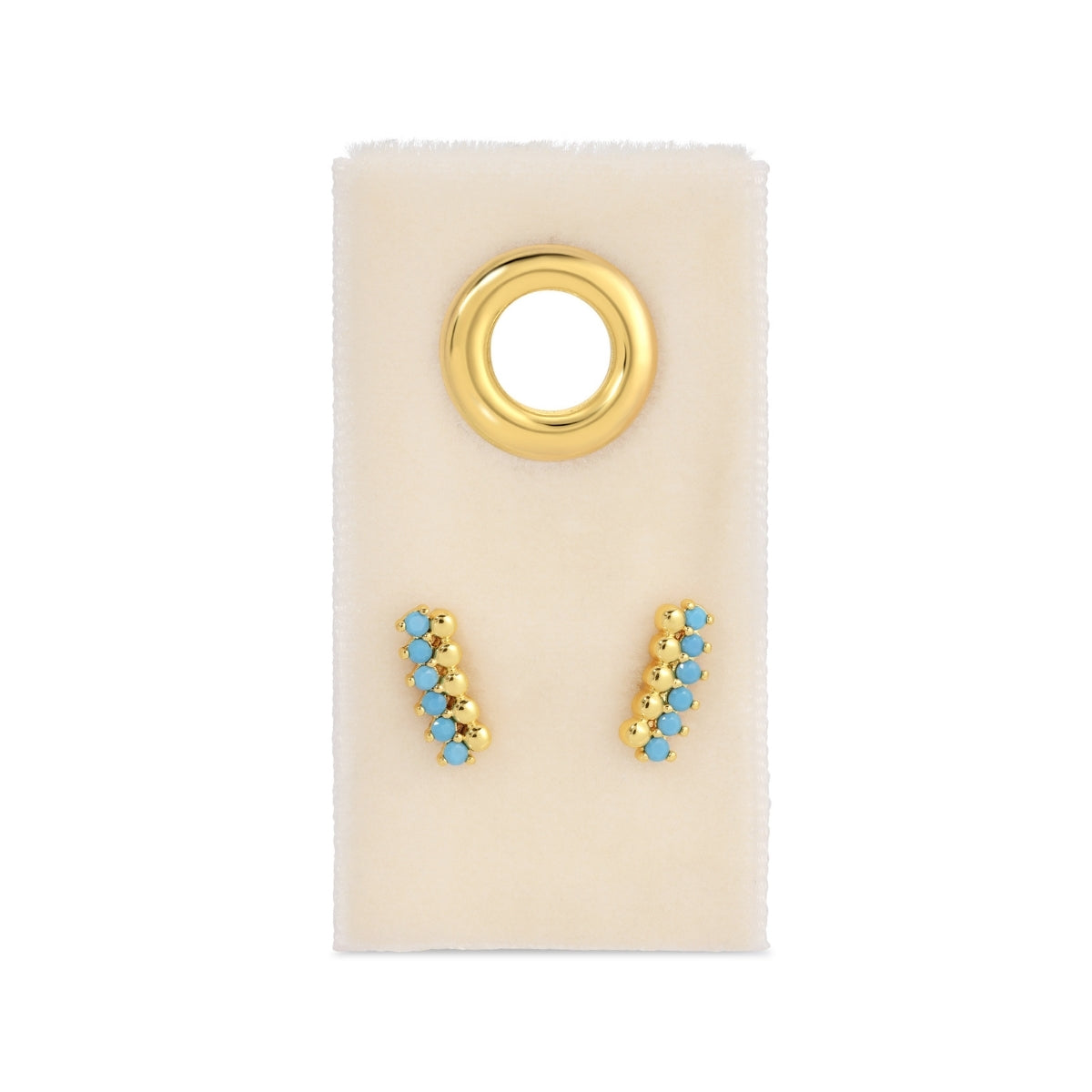 Gold and turquoise earrings on a display card with a gold ring.