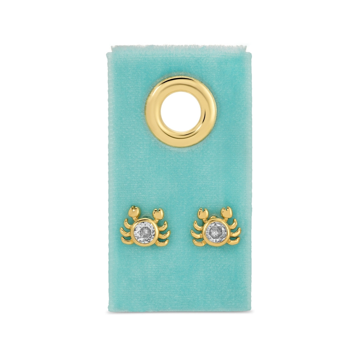 Gold crab-shaped earrings on a turquoise card with a gold ring.