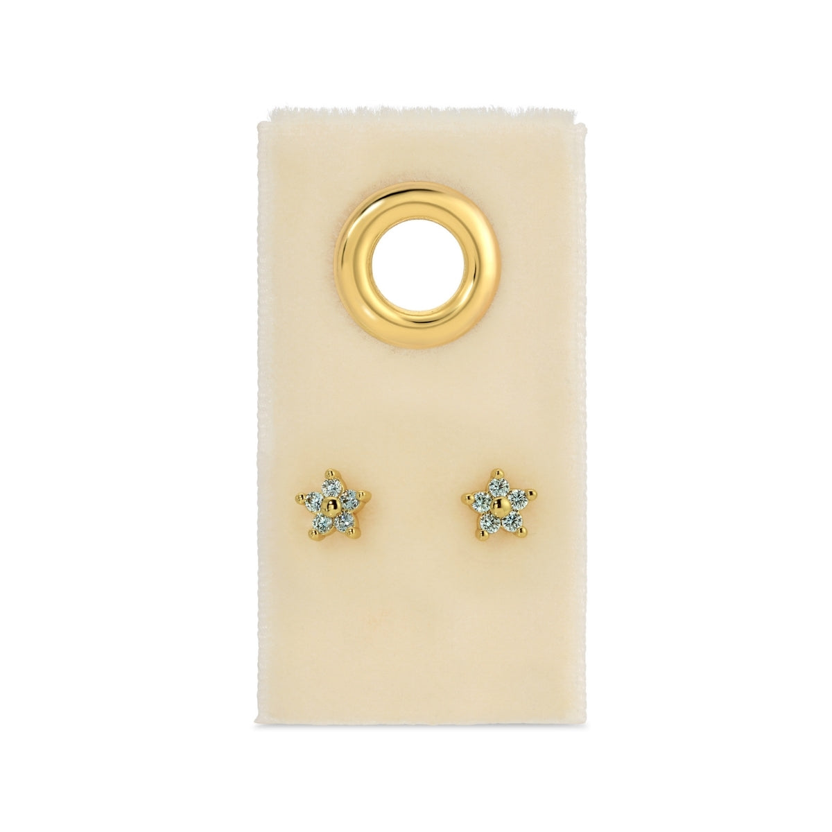 Gold star-shaped earrings on a beige card with a gold ring design.