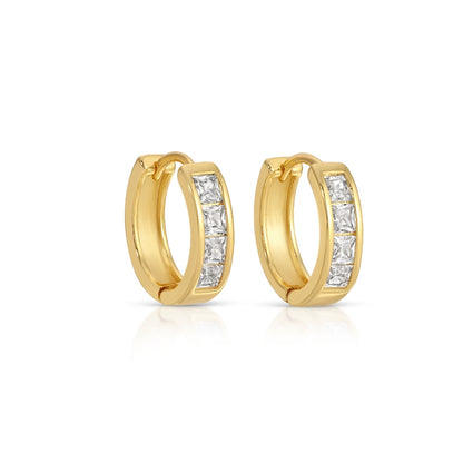Gold hoop earrings with embedded diamonds on a white background