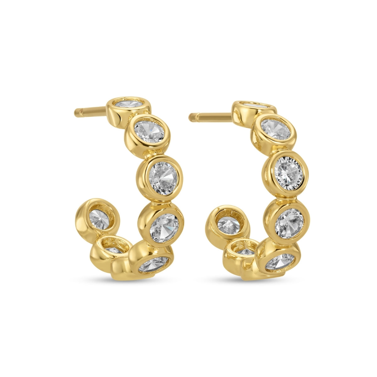 Gold hoop earrings with clear gemstones on a white background