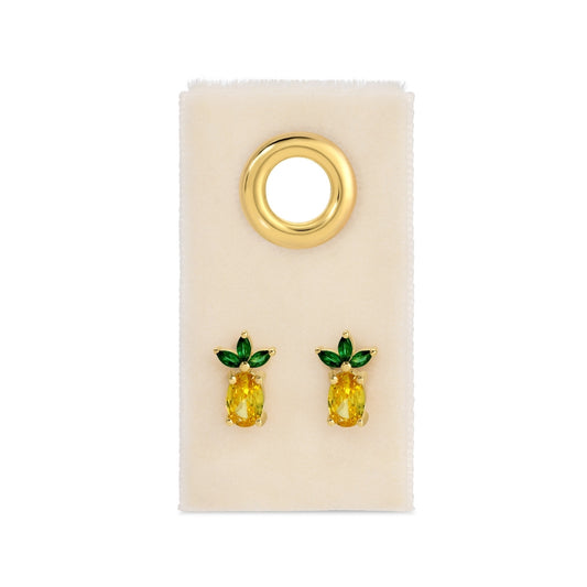 Pineapple-shaped earrings on a beige card with a gold hoop.