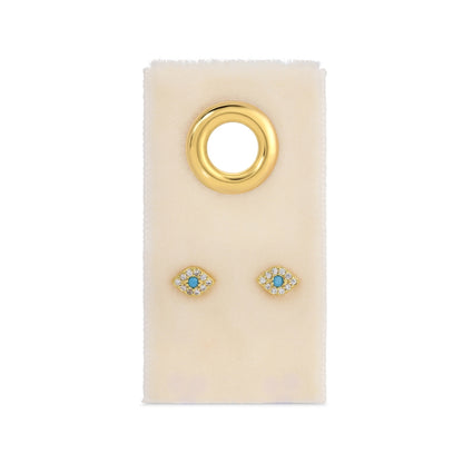 Gold earrings with turquoise stones on a white card