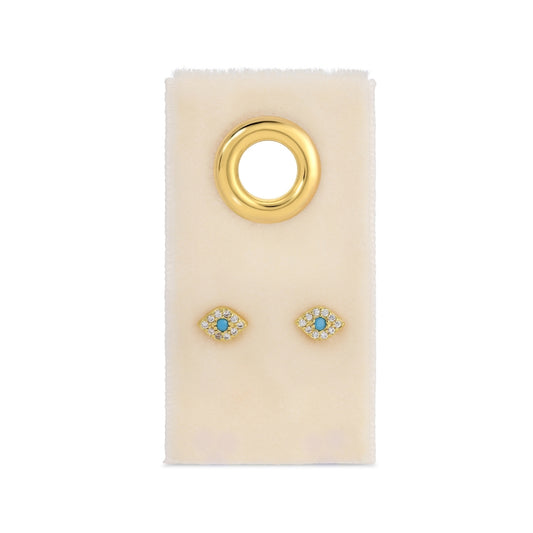 Gold earrings with turquoise stones on a white card