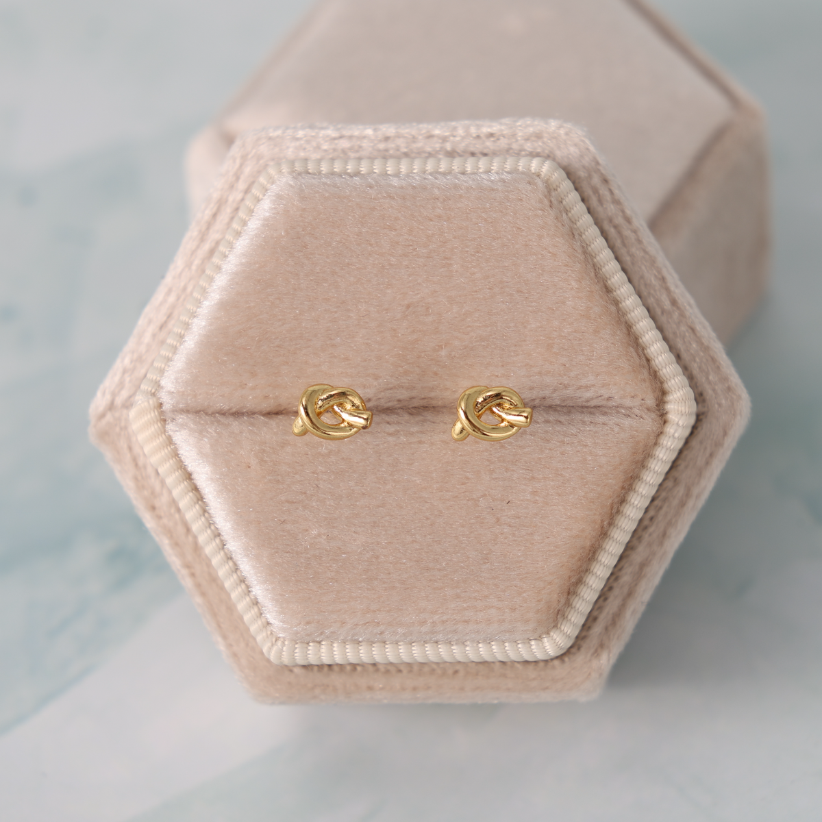 Minimalist Knot Studs on Velvet Tag