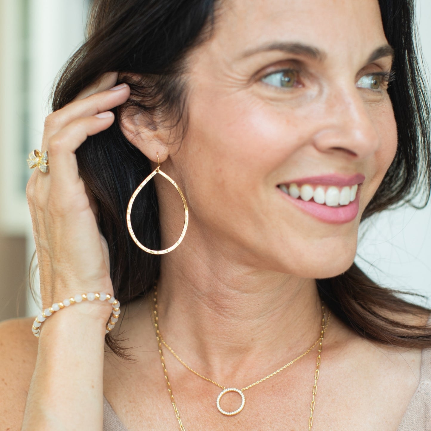 Large lightly hammered open teardrop earrings