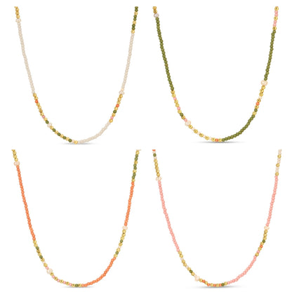 Set of four beaded necklaces with gradient colors on a white background