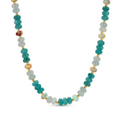 Necklace with turquoise, white, and gold beads on a white background