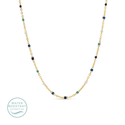 Necklace with gold chain and multicolored beads on a white background