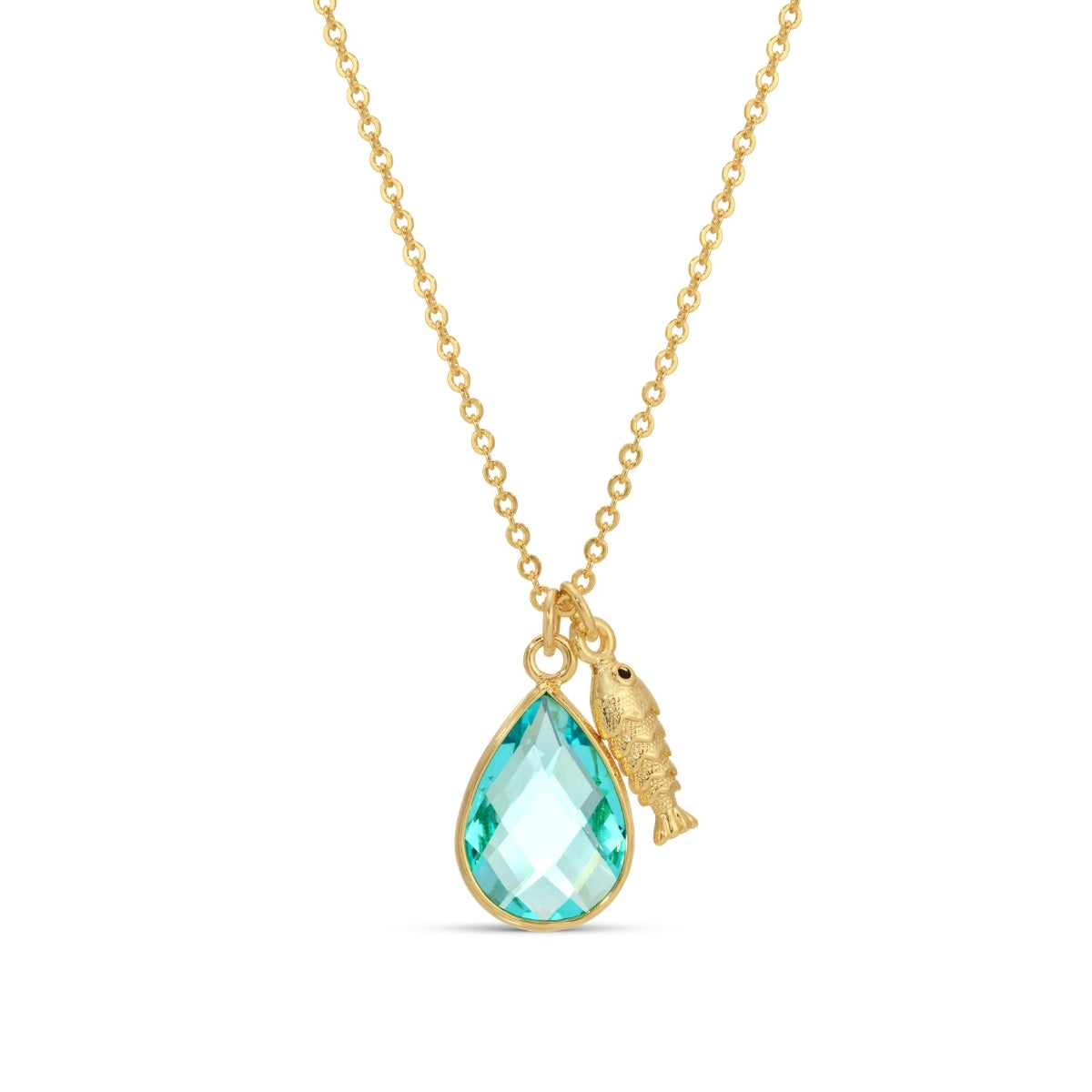 Gold necklace with a green teardrop pendant and gold fish charm on a white background