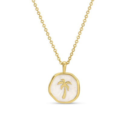 Gold necklace with a palm tree pendant on a white background