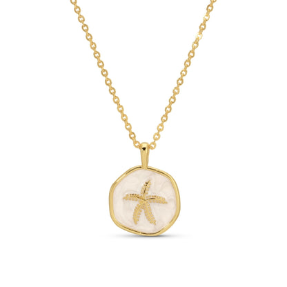 Gold necklace with a starfish pendant on a white background
