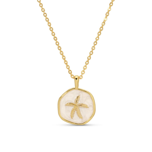 Gold necklace with a starfish pendant on a white background