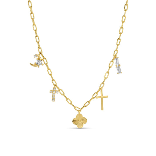 Gold necklace with various pendants on a white background