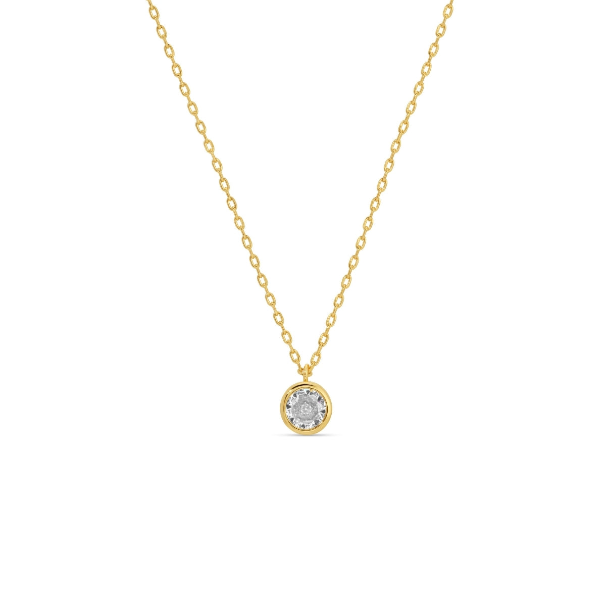 Gold necklace with a round pendant on a white background