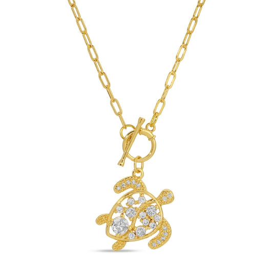 Gold turtle pendant necklace with diamonds on a white background