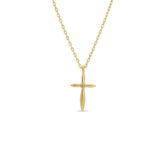Gold cross necklace with a diamond on a white background