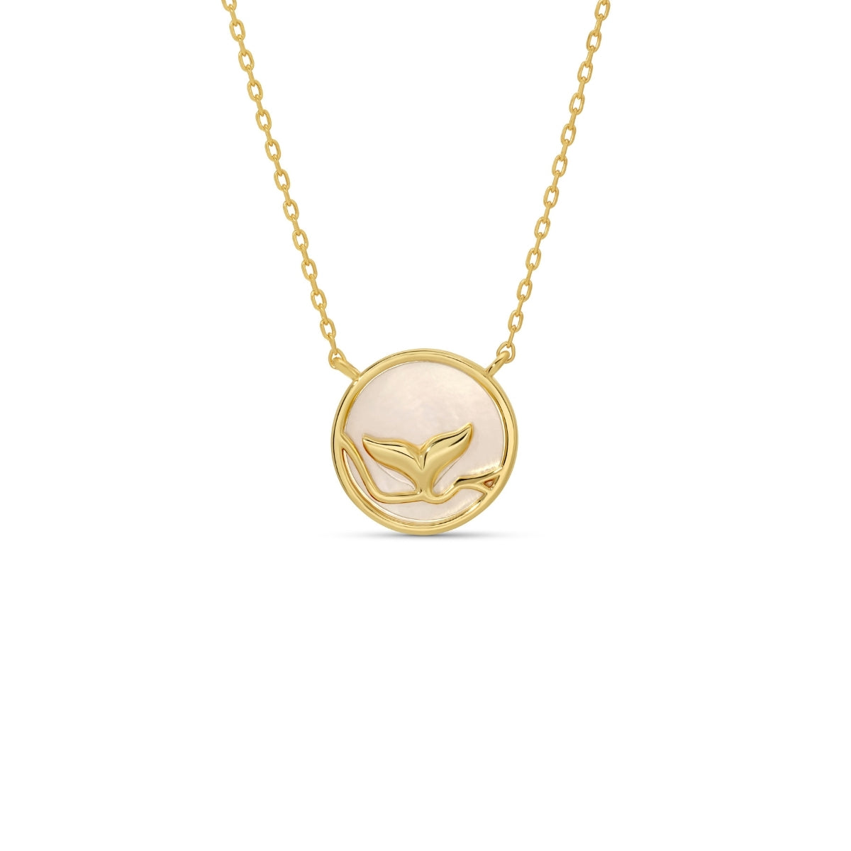 Gold necklace with a circular pendant featuring a whale design on a white background