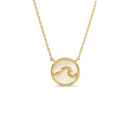 Gold necklace with a circular pendant featuring a wave design on a white background