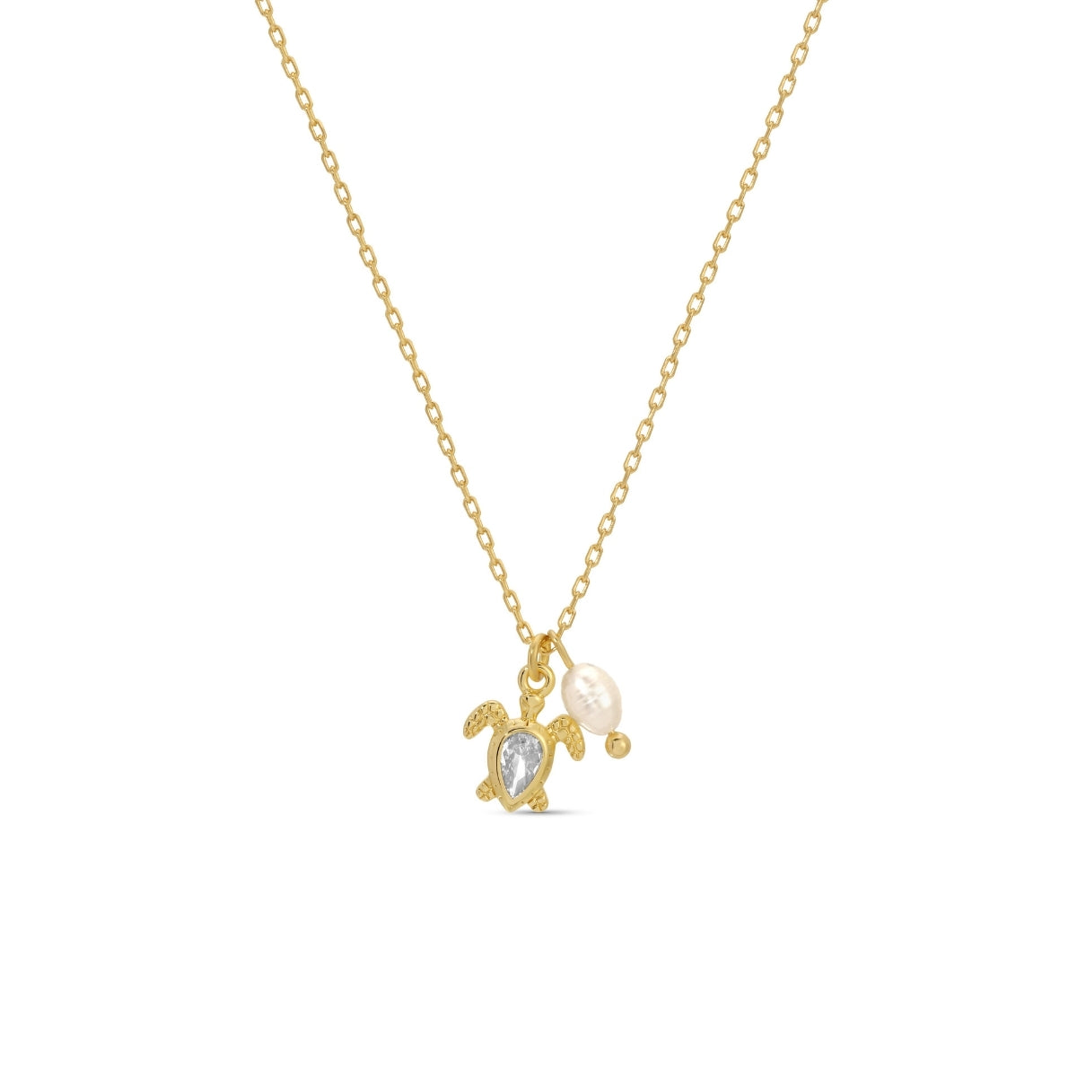 Gold necklace with turtle and pearl pendant on a white background