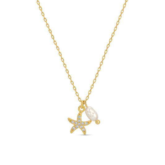 Gold necklace with starfish and pearl pendant on a white background