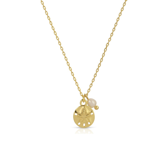 Gold necklace with a small round pendant and pearl on a white background