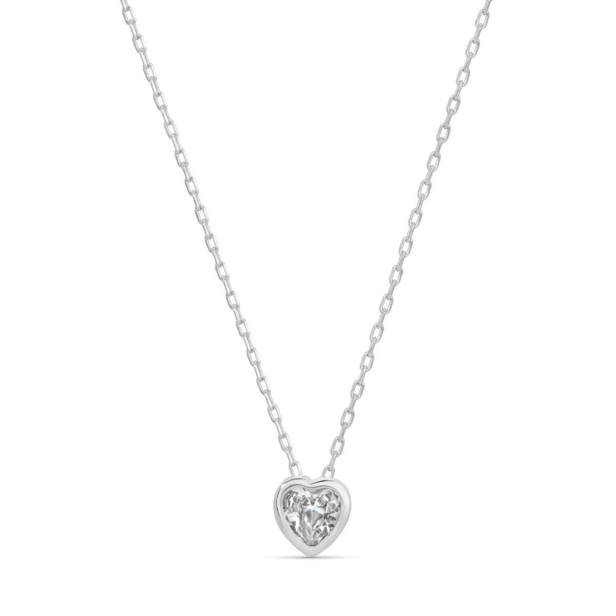 Heart-shaped diamond pendant on a chain against a white background