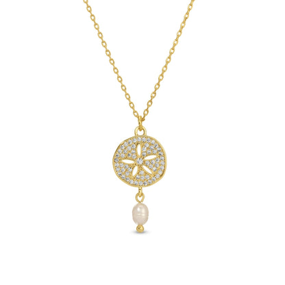 Gold necklace with a sand dollar pendant and pearl on a white background