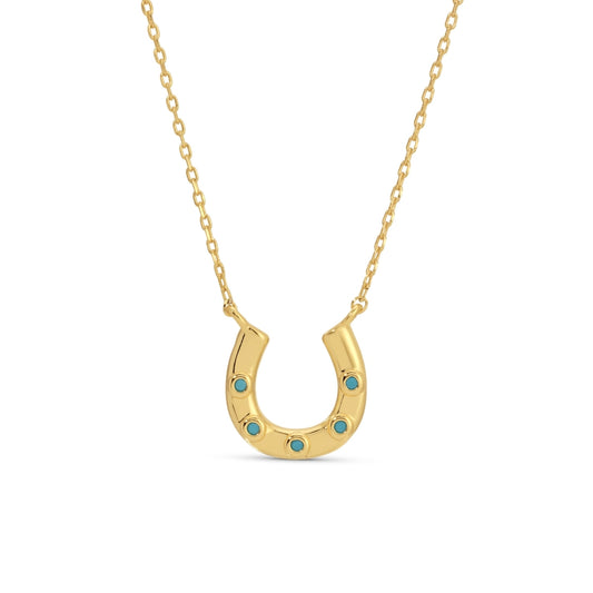 Gold horseshoe necklace with turquoise stones on a white background