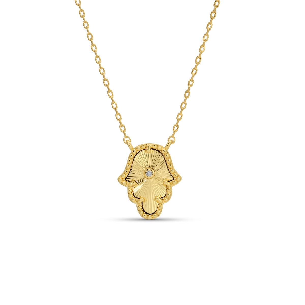 Gold Hamsa hand necklace on a white background