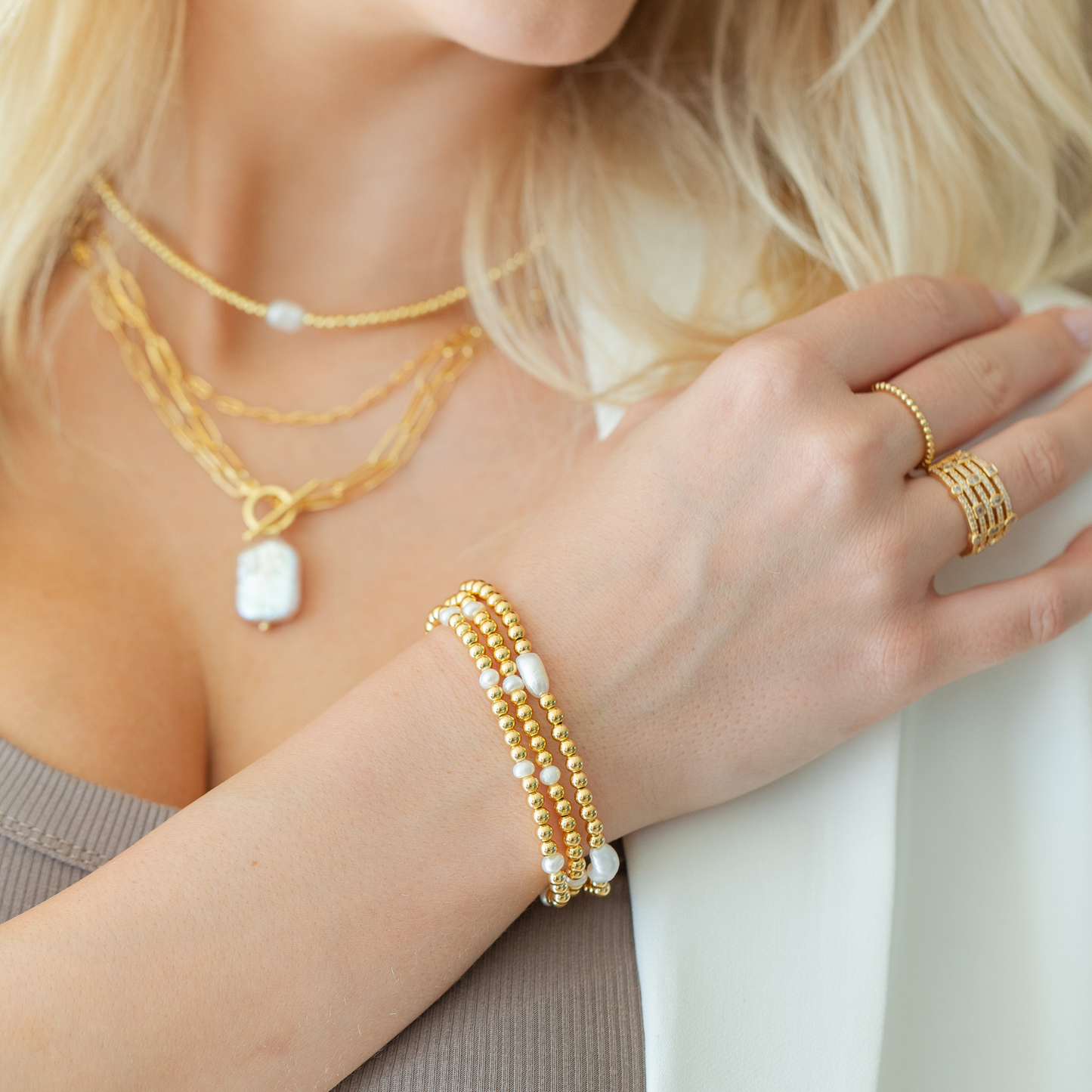 Set/12 4mm stretch bracelet with 4 medium sized pearl accents