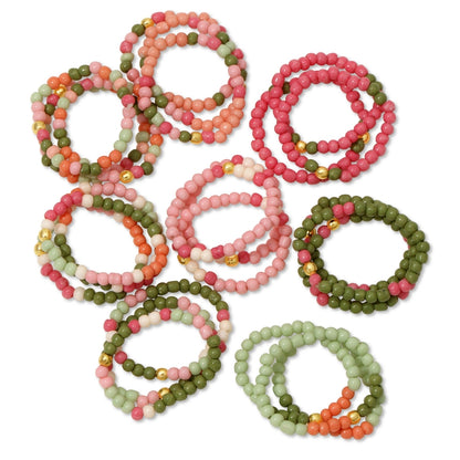 Set of colorful beaded rings on a white background